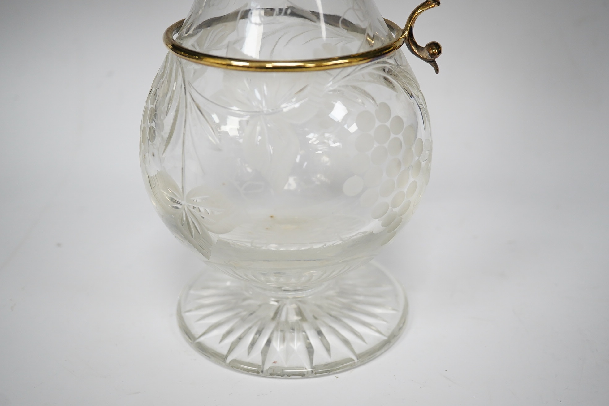 A modern silver gilt mounted cut glass pyriform claret jug, maker JM, Sheffield, 2001, 31.2cm. Condition - good